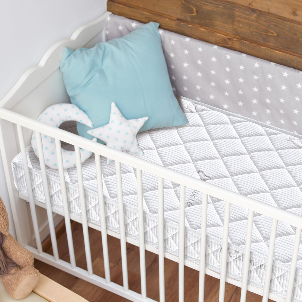Letmxiu premium crib mattress seamless-fit demonstrates full coverage on standard cribs.