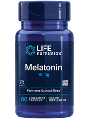 Life Extension Melatonin 10 mg bottle on nightstand for restful sleep support.