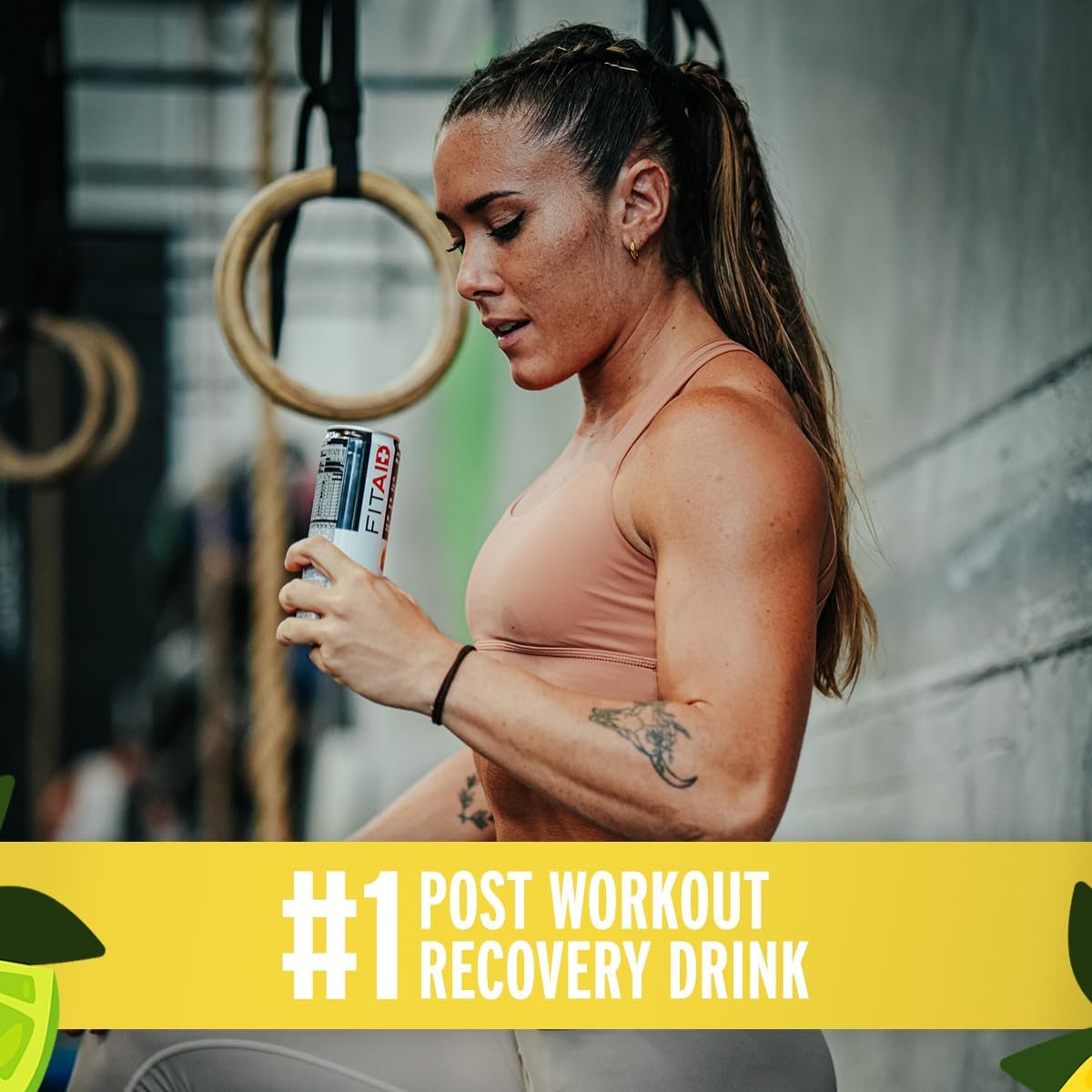 Scoop with citrus-flavored FITAID Recovery Blend illustrating easy mixing