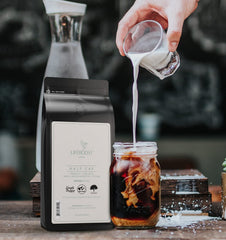 LIFEBOOST Half Caff coffee brewed in a mug emphasizes balanced flavor and aroma.