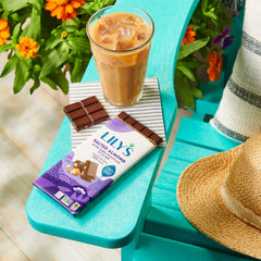 LILY'S Salted Almond Extra Dark Bar on a desk suggesting a mindful snack
