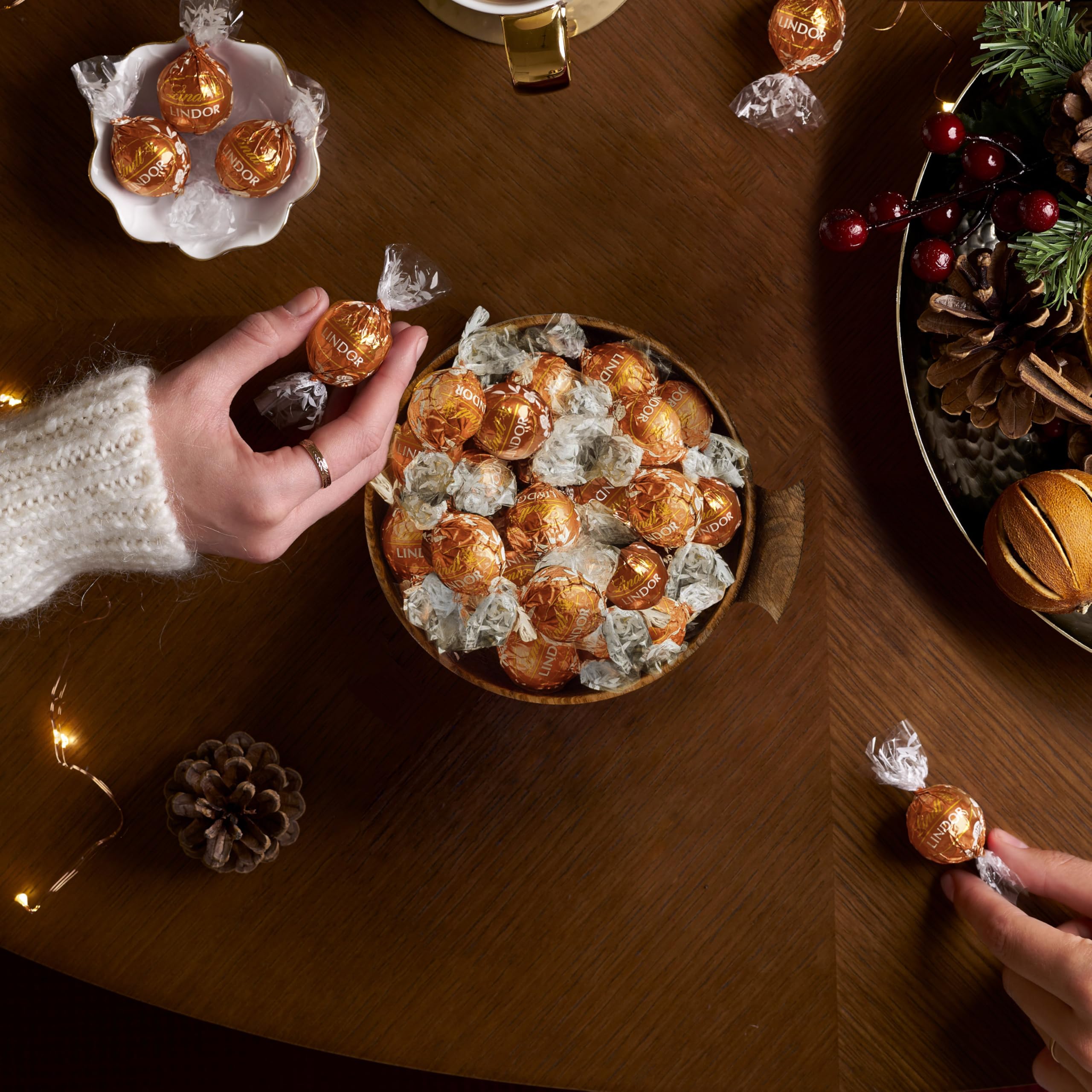 Lindt Lindor Snickerdoodle truffles with white shell and cookie crunch.