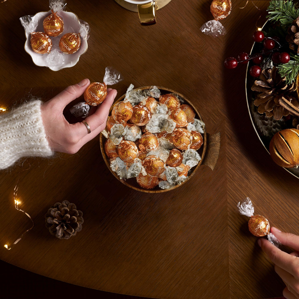 Lindt Lindor Snickerdoodle truffles with white shell and cookie crunch.