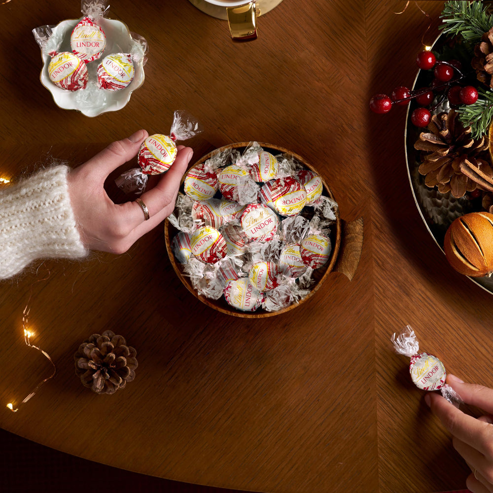 Lindt Lindor White Chocolate Shell Peppermint Center close-up highlights creamy texture.