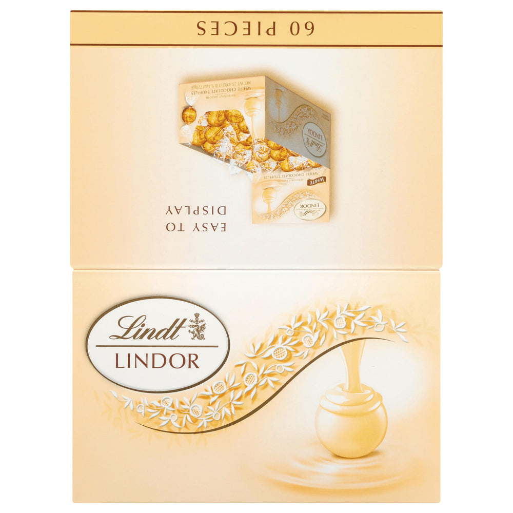 Lindt LINDOR White Chocolate Truffles on an elegant dessert plate.
