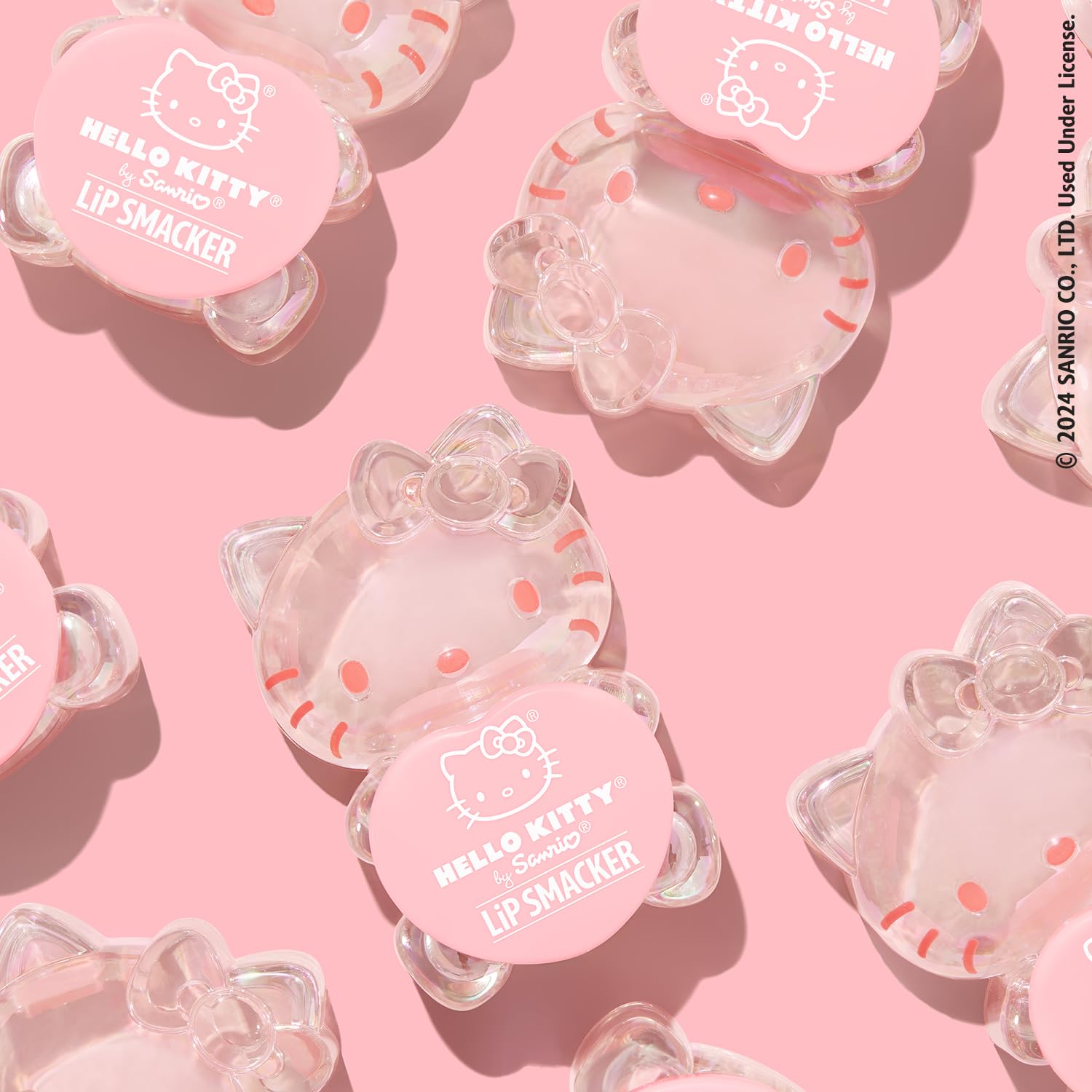 Lip Smacker Hello Kitty Peach Gummy lip balm on lips adds soft shine and moisture.
