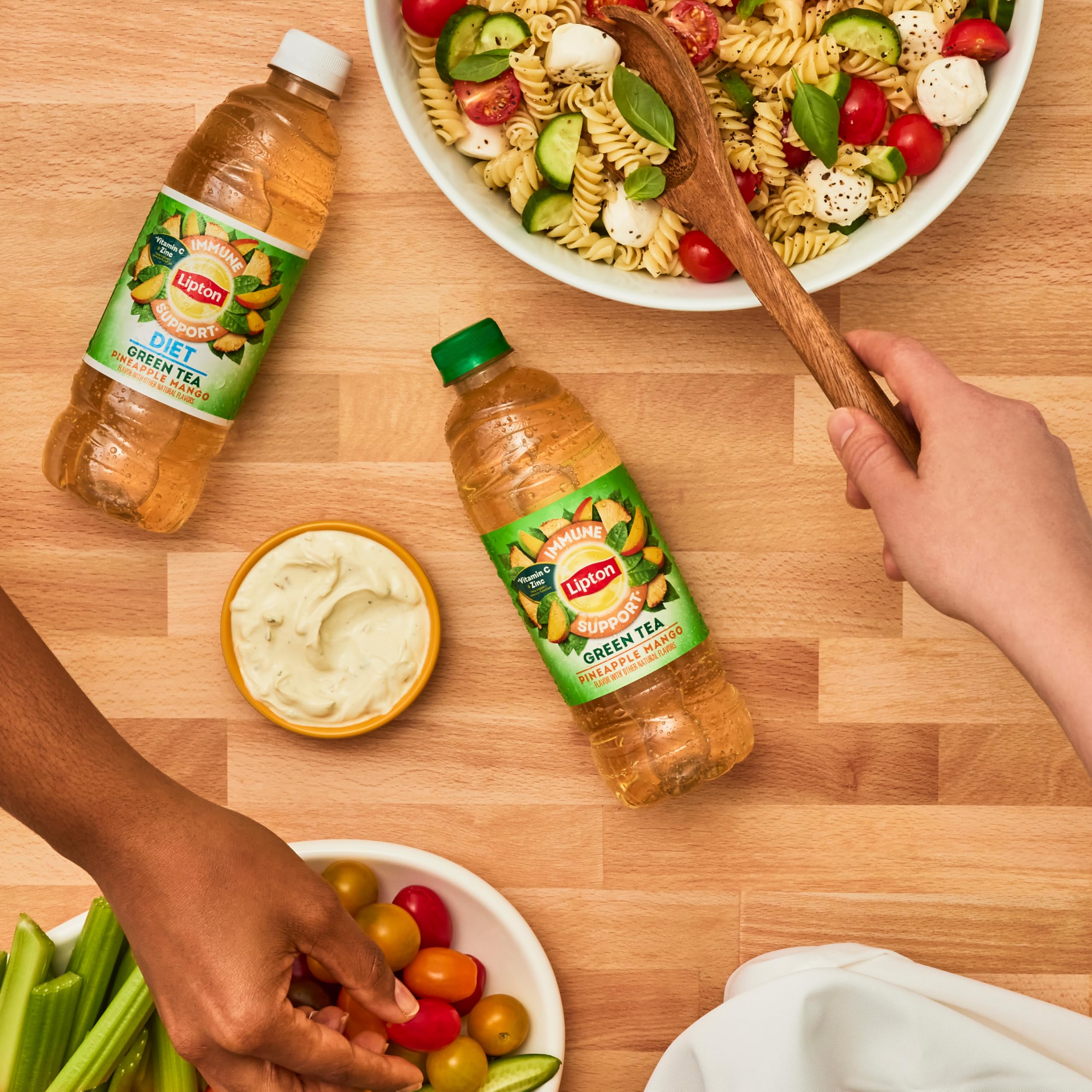 Lipton recyclable bottles pack featuring Pineapple Mango flavor for eco-friendly refreshment