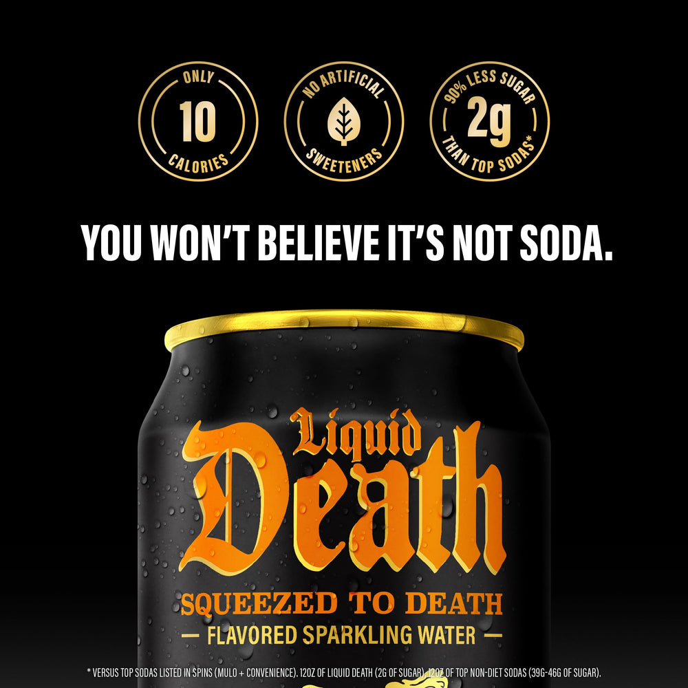 Liquid Death orange soda in a glass highlights juicy flavor for tasting.
