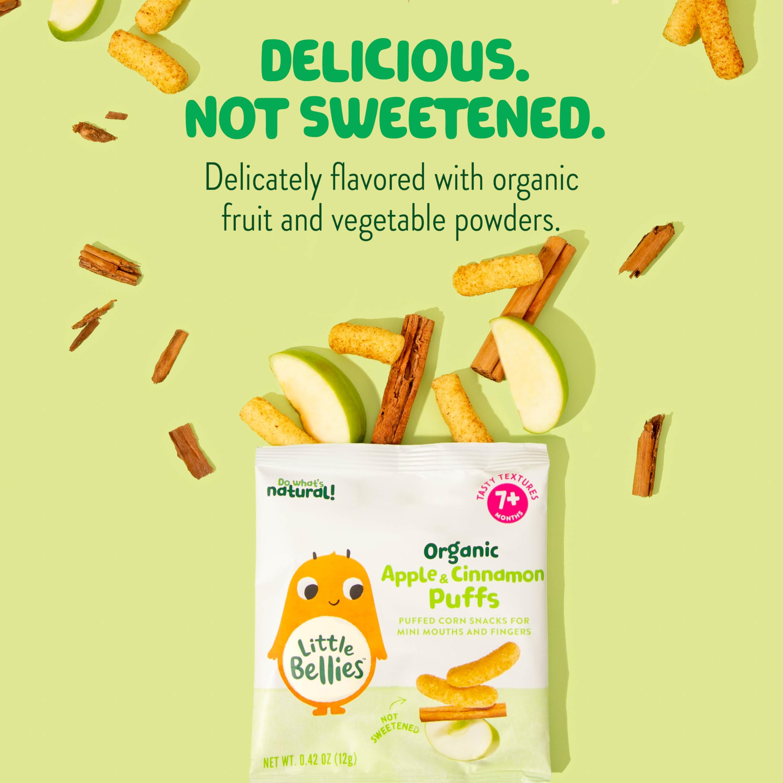 Baby hands holding Little Bellies Apple Cinnamon Puffs, easy for little fingers to grip.