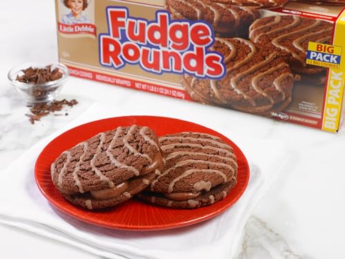 Stacked Little Debbie Fudge Rounds sandwich cookies highlighting soft texture.