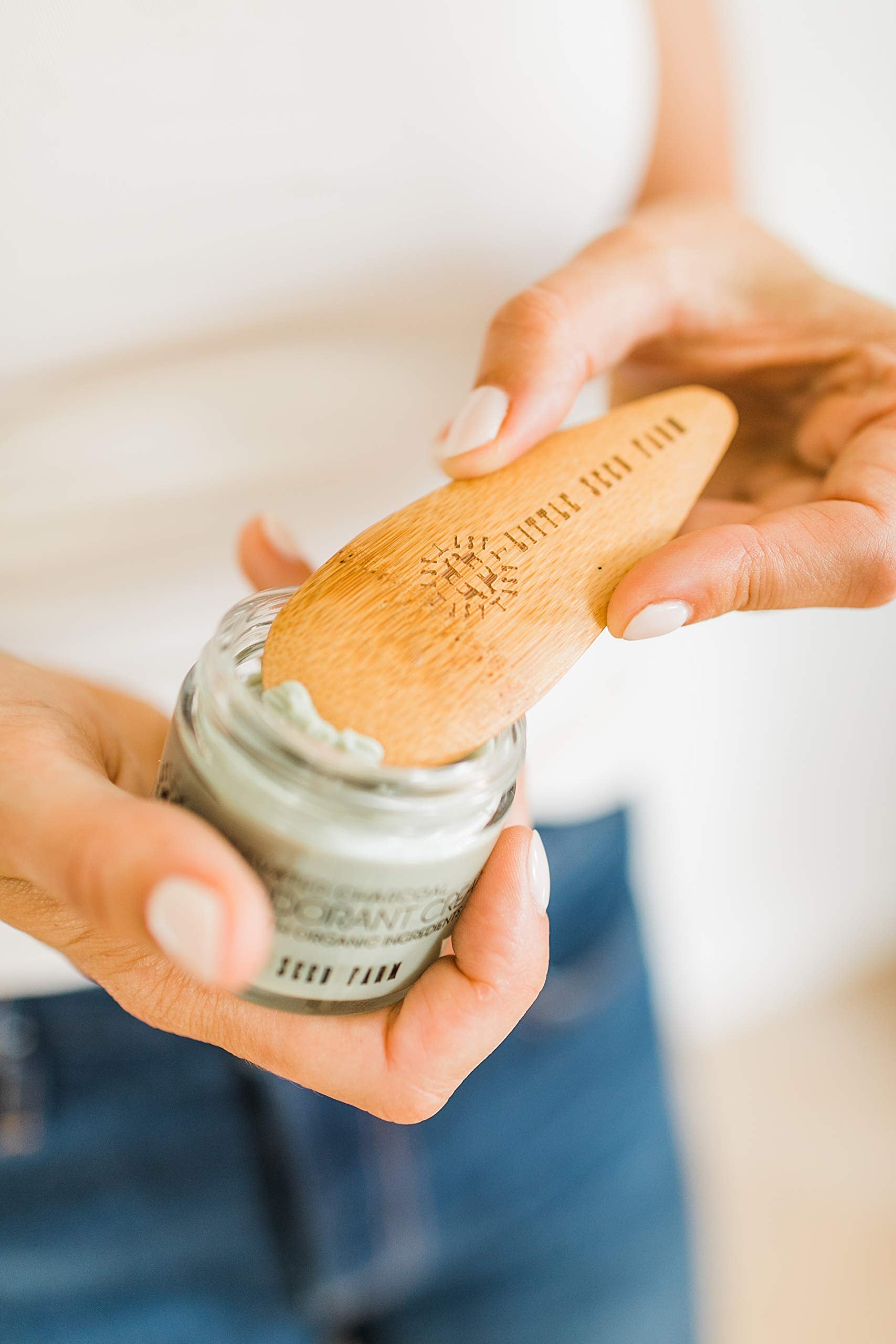 Compact, reusable deodorant scoop reducing waste and mess.