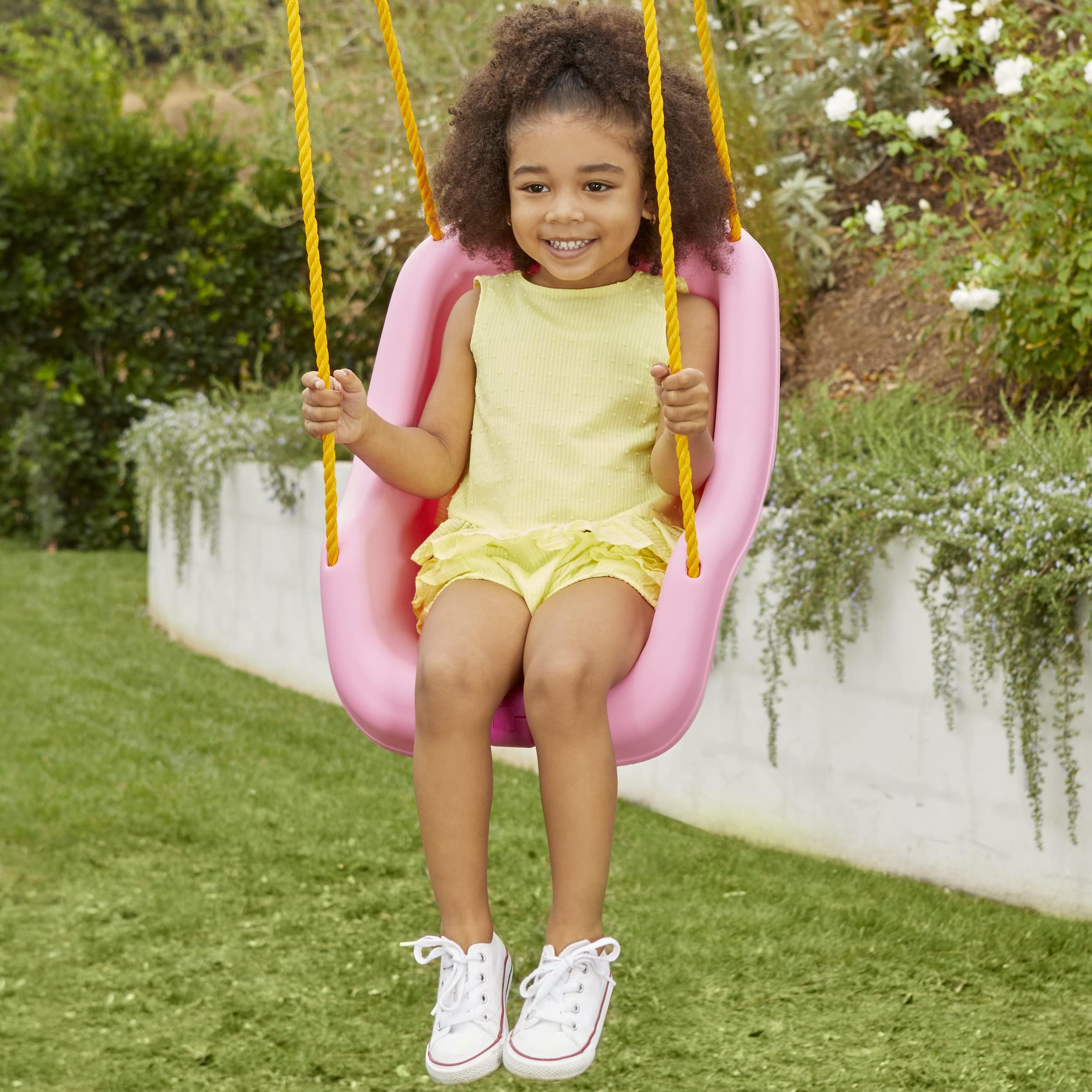 USA-made Little Tikes Snug 'n Secure Swing highlights quality construction for safe play.