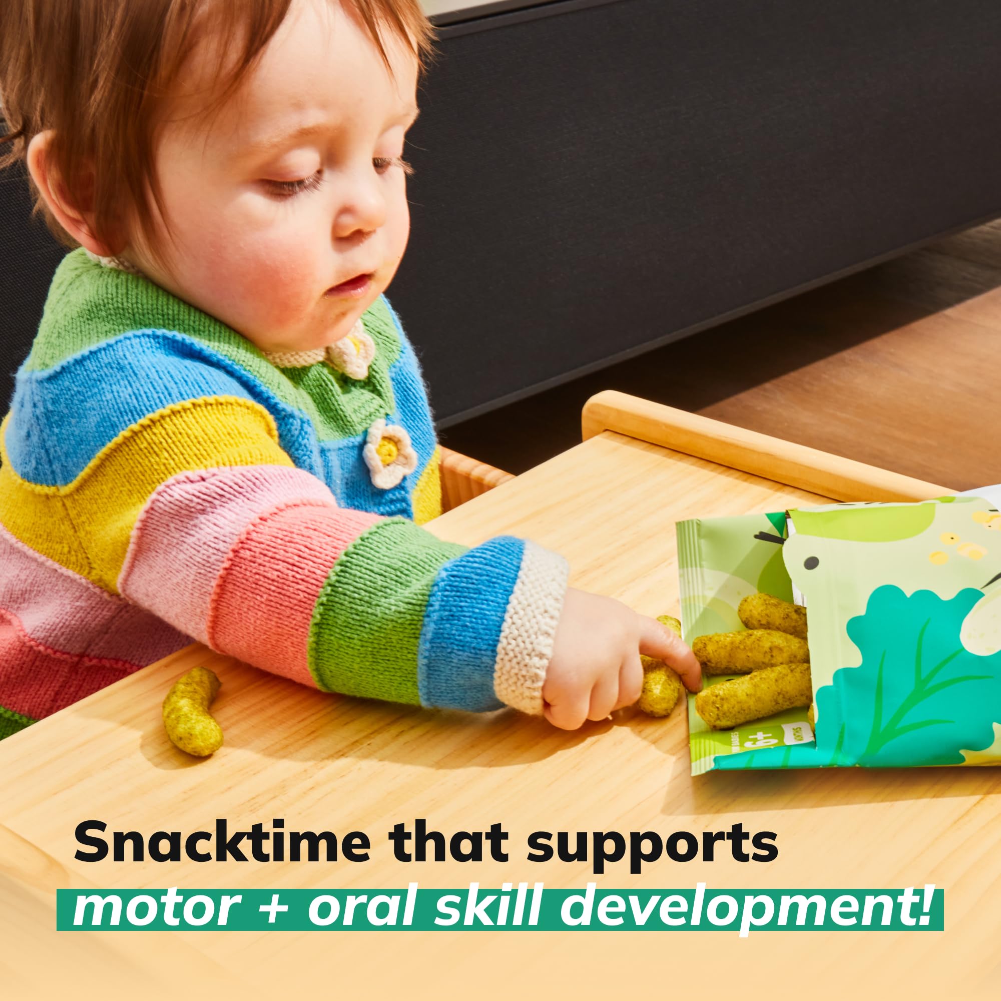 Baby on-the-go snacking scene with easy-open packaging.