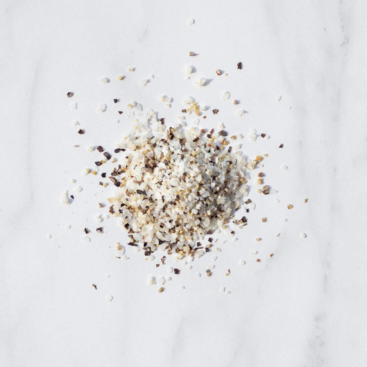 Livia’s Salt Pepper Garlic Seasoning shaker on hand for quick, even everyday seasoning