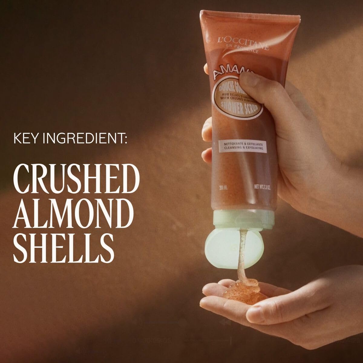 Loccitane Almond Shower Scrub tube close-up highlights packaging and design.