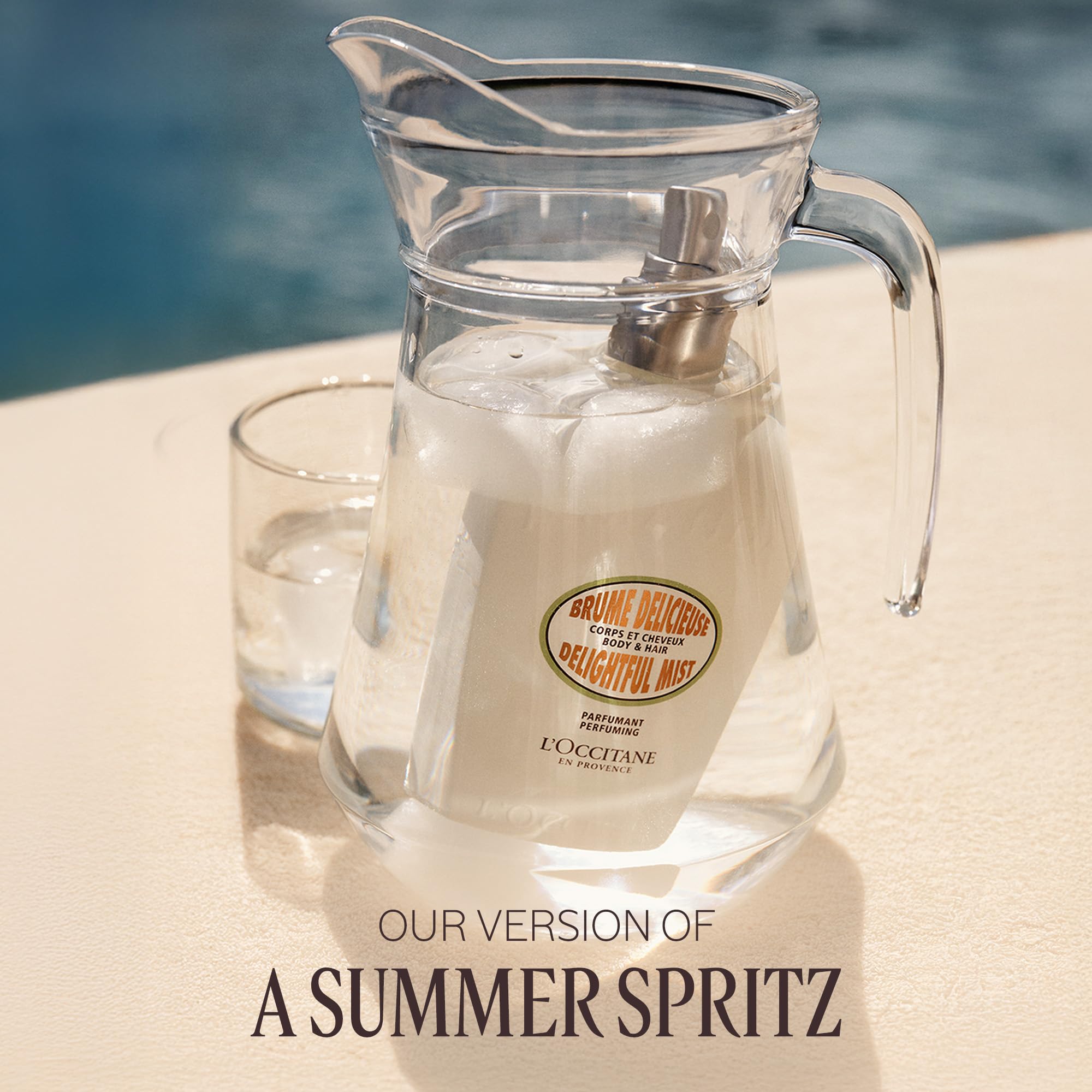 L'OCCITANE Almond mist in sunlit lifestyle scene.
