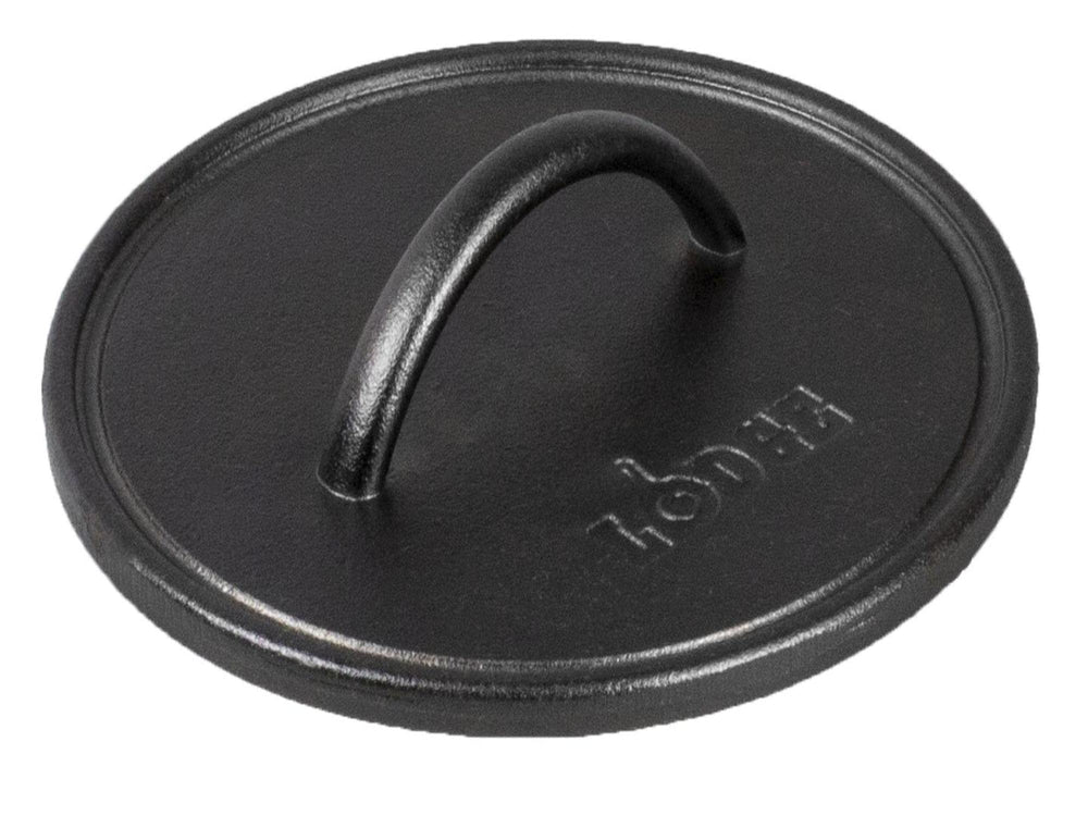 Lodge pre-seasoned round cast iron press close-up of the spiral handle for safe, comfortable grilling.