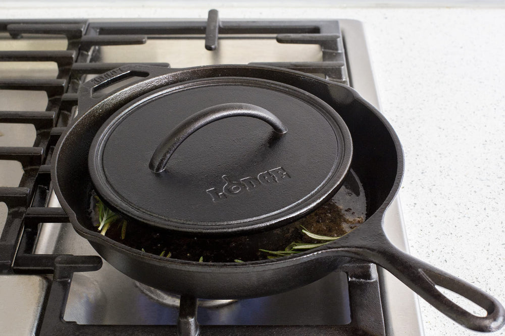 Lodge pre-seasoned round cast iron press on stovetop delivers even sear and grease control.
