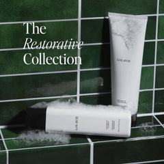 LolaVie Restorative Conditioner bottle highlighting smoothing and silky hair results.