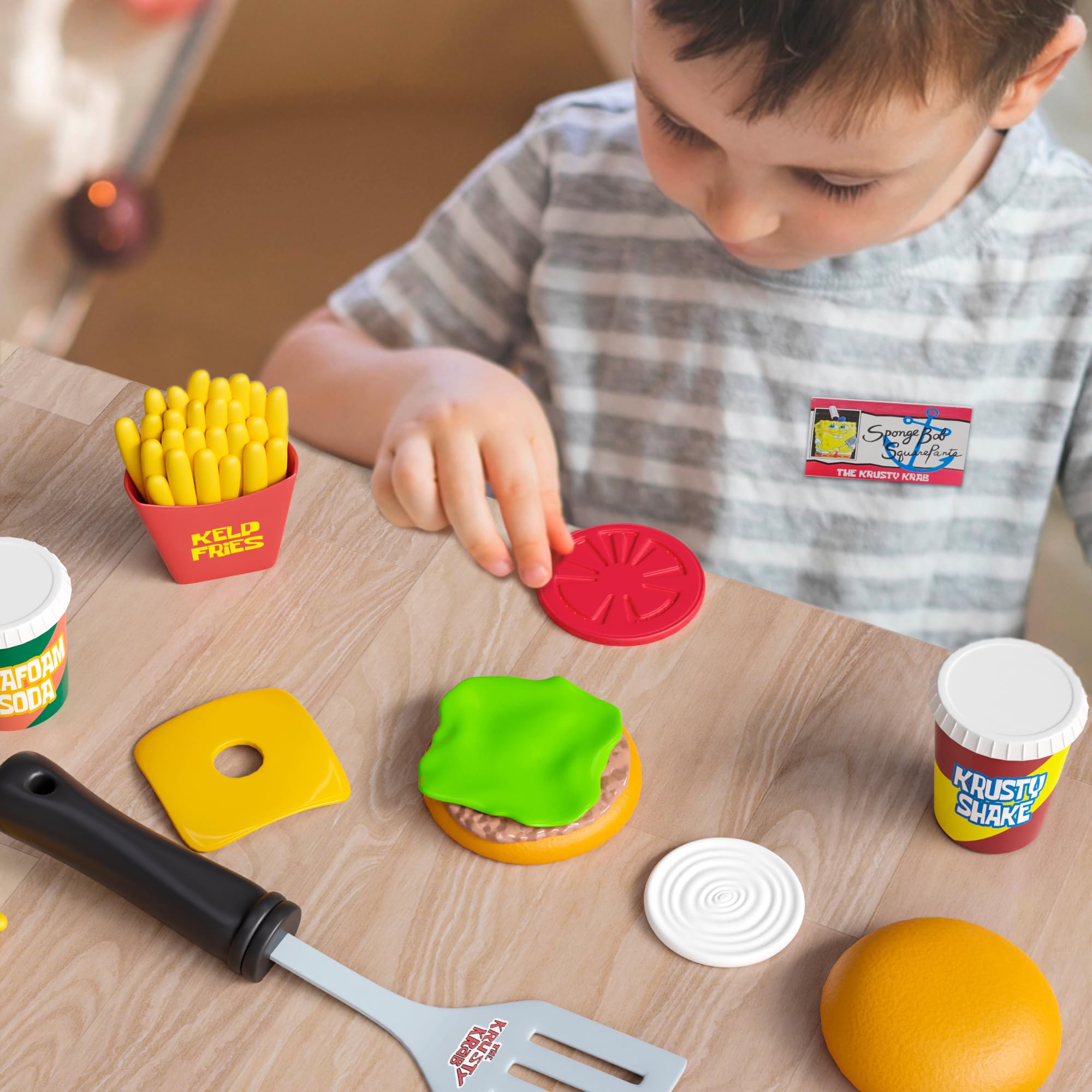 Lollipop Velcro dots keep playset pieces handy for quick setup.