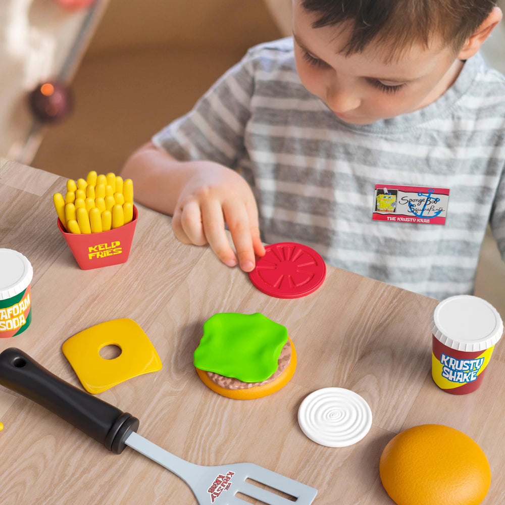 Lollipop Velcro dots keep playset pieces handy for quick setup.
