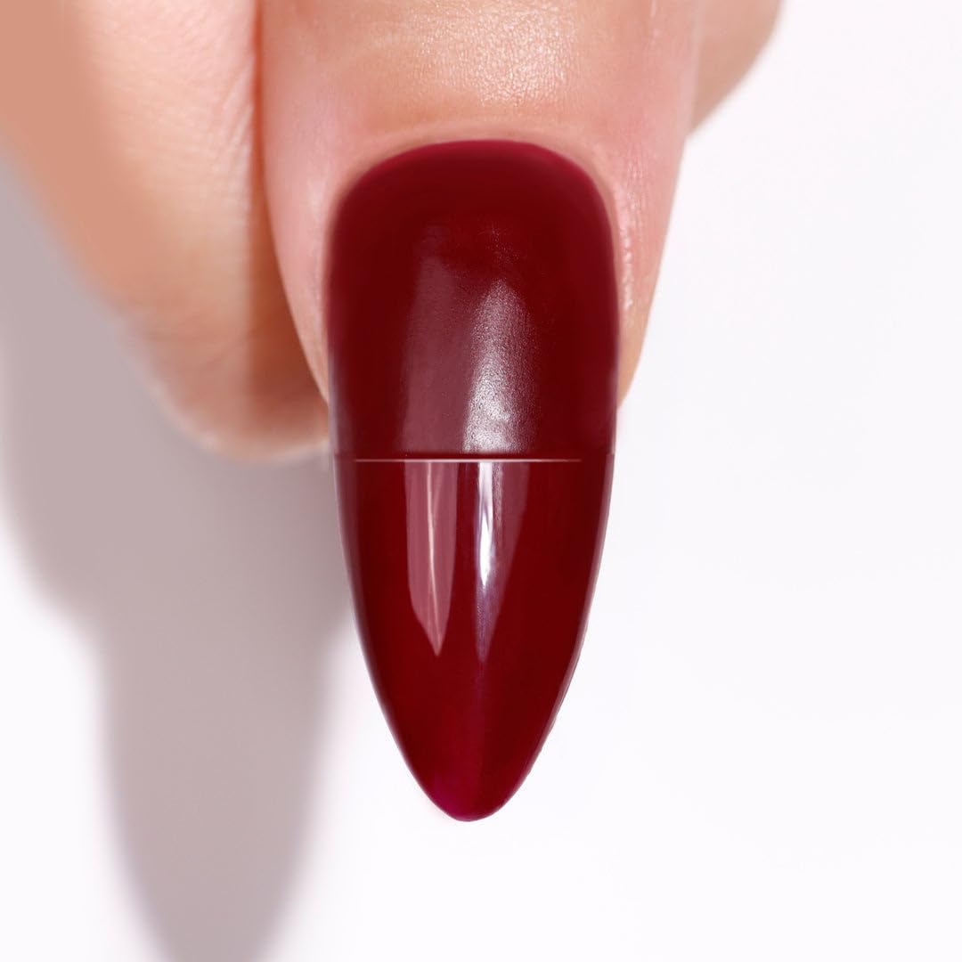 LONDONTOWN kur Flash Dry Top Coat shiny finish on nails.