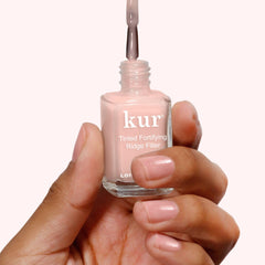 LONDONTOWN Kur Nail Ridge Filler nail swatch in petal pink with sheer tint