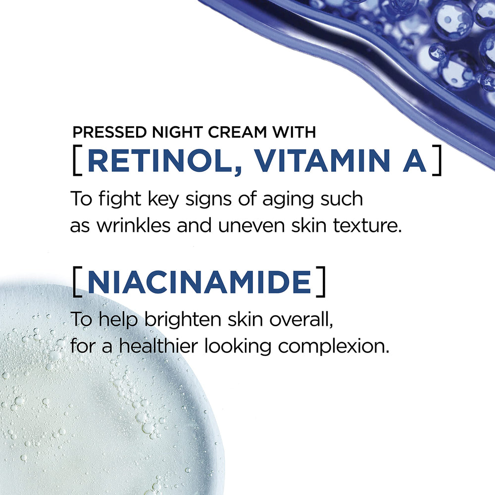 Close-up of night cream texture on finger, ready for quick absorption.