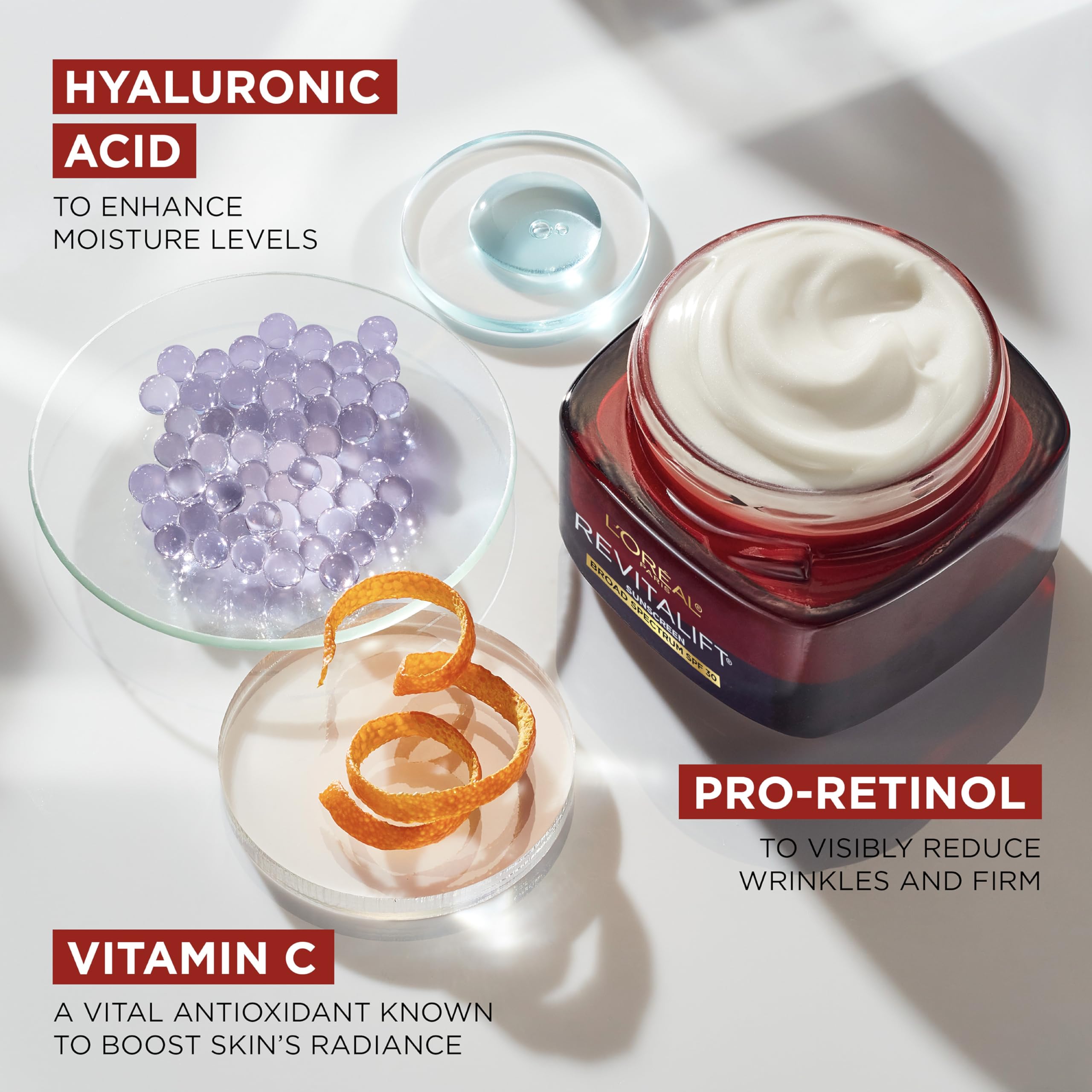 L'Oreal Paris Triple Power cream on skin demonstrates lightweight, non-greasy feel.