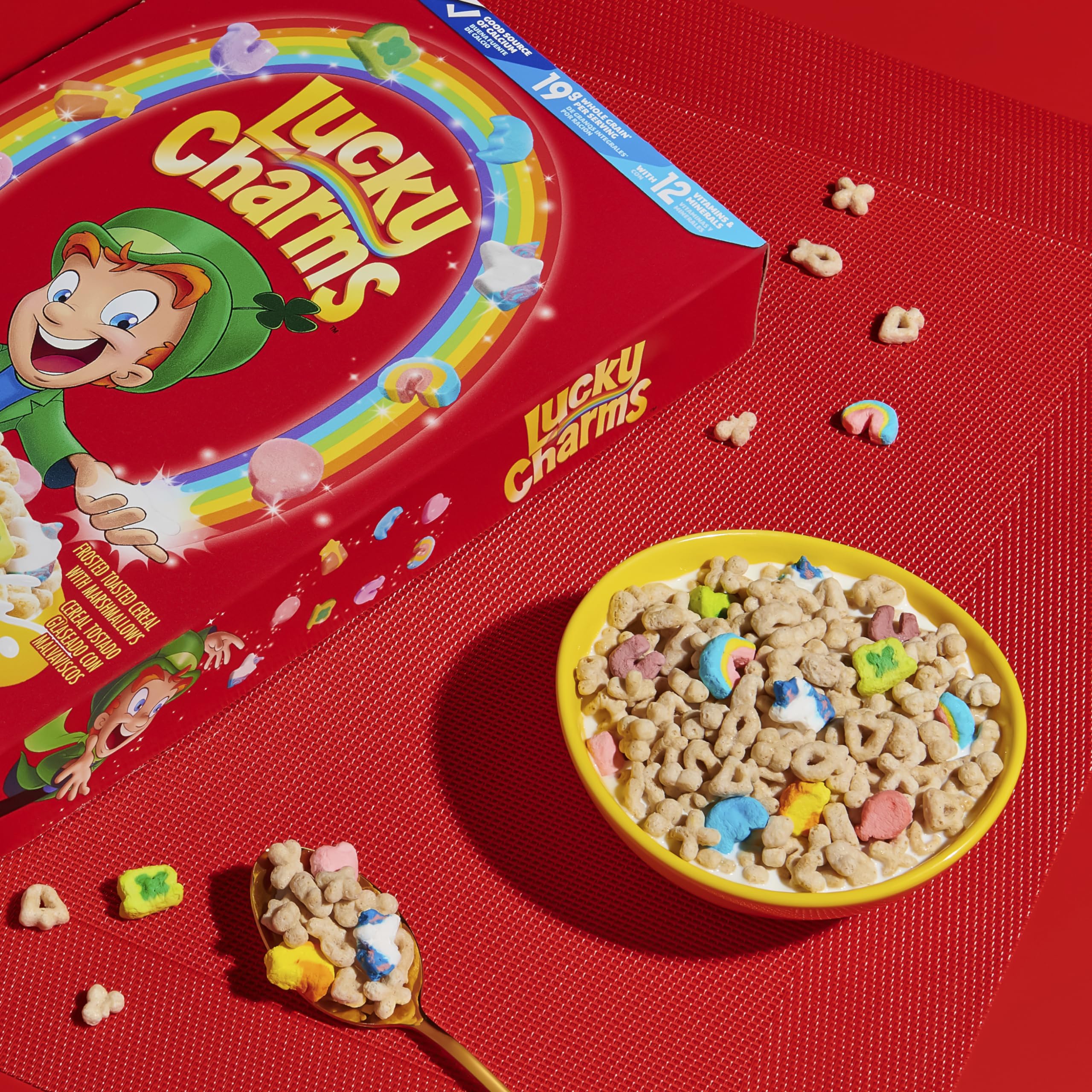 Cereal with milk and marshmallows drifting in a bowl.