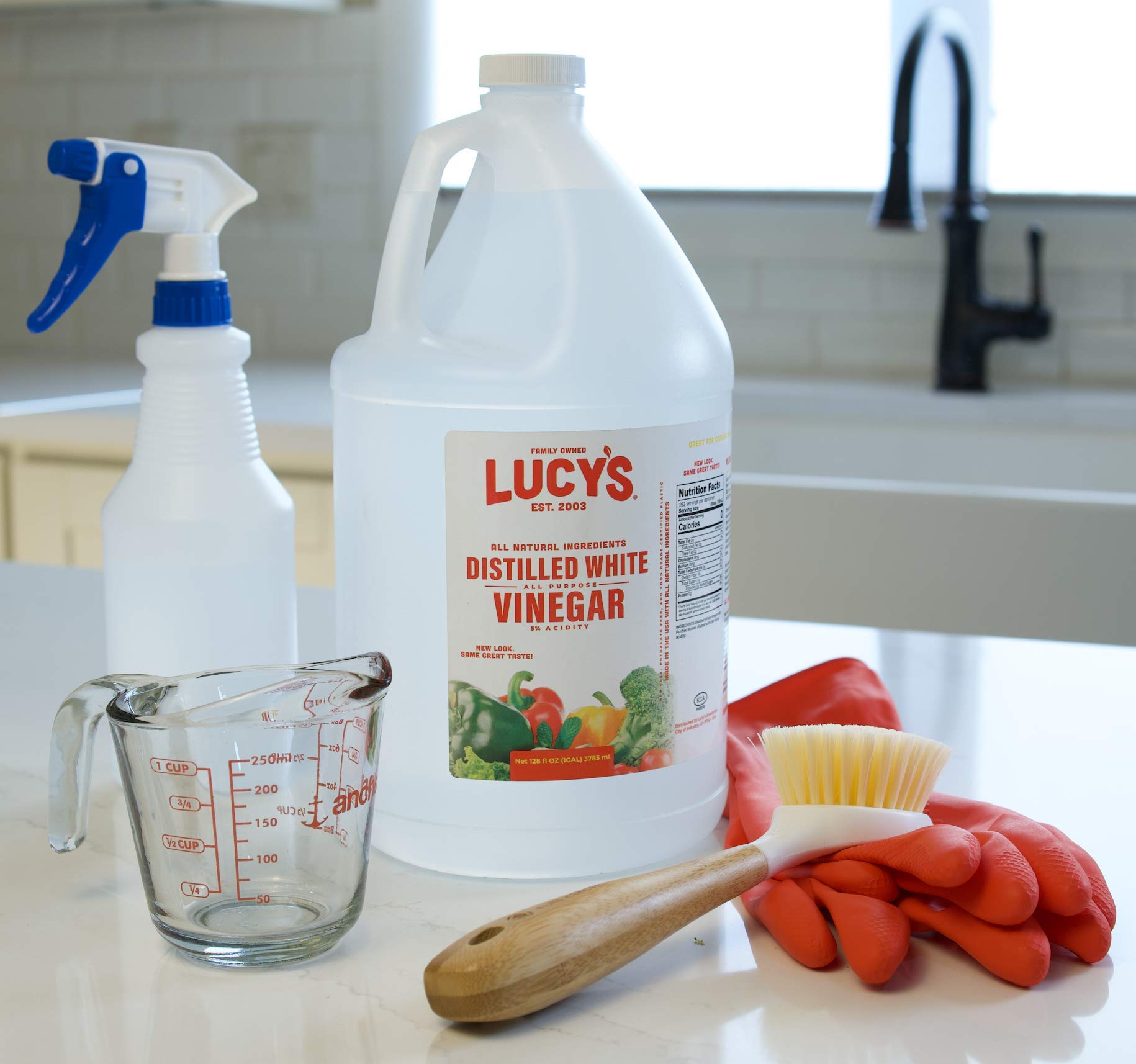 Lucys White Vinegar eco-friendly bottle highlighting biodegradable formula