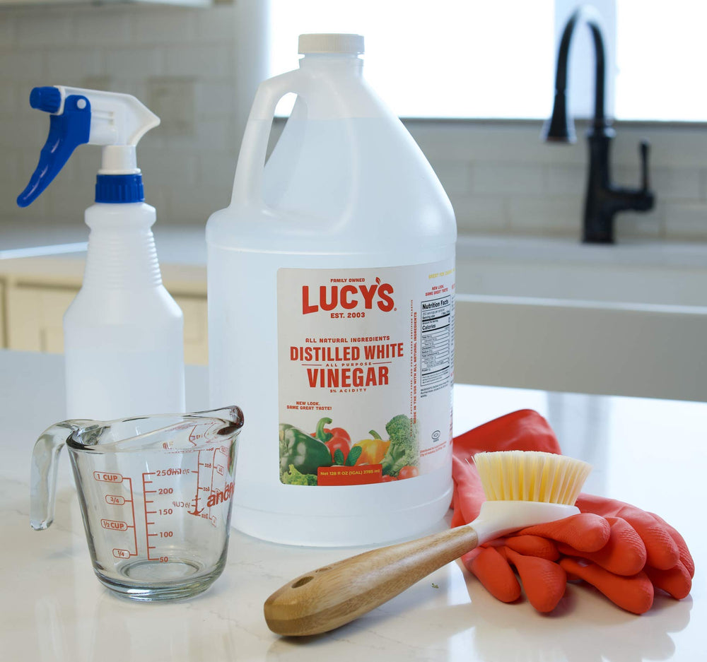 Lucys White Vinegar eco-friendly bottle highlighting biodegradable formula