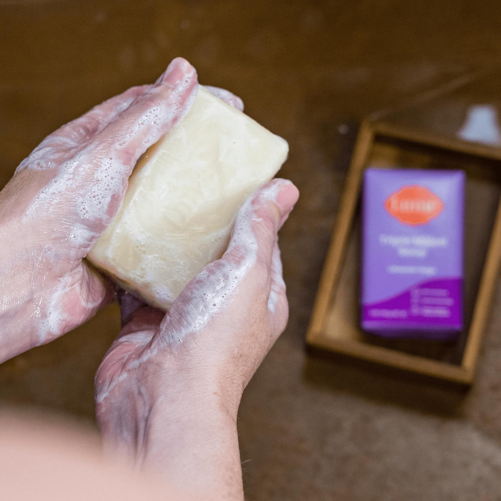 Lume Hand applying Lavender Sage solid deodorant.