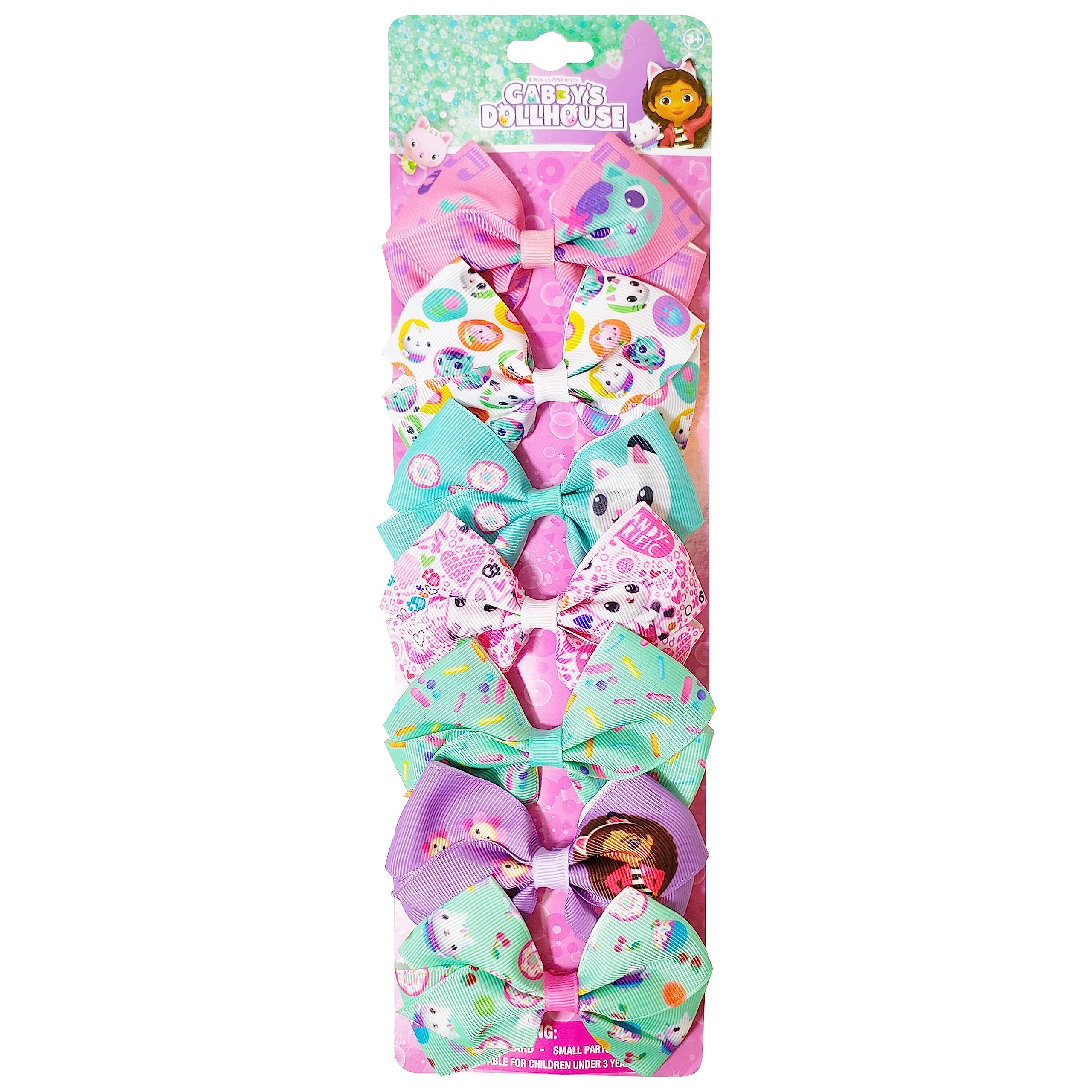 Luv Her Gabby's Dollhouse princess clip secures hair during playful activities.