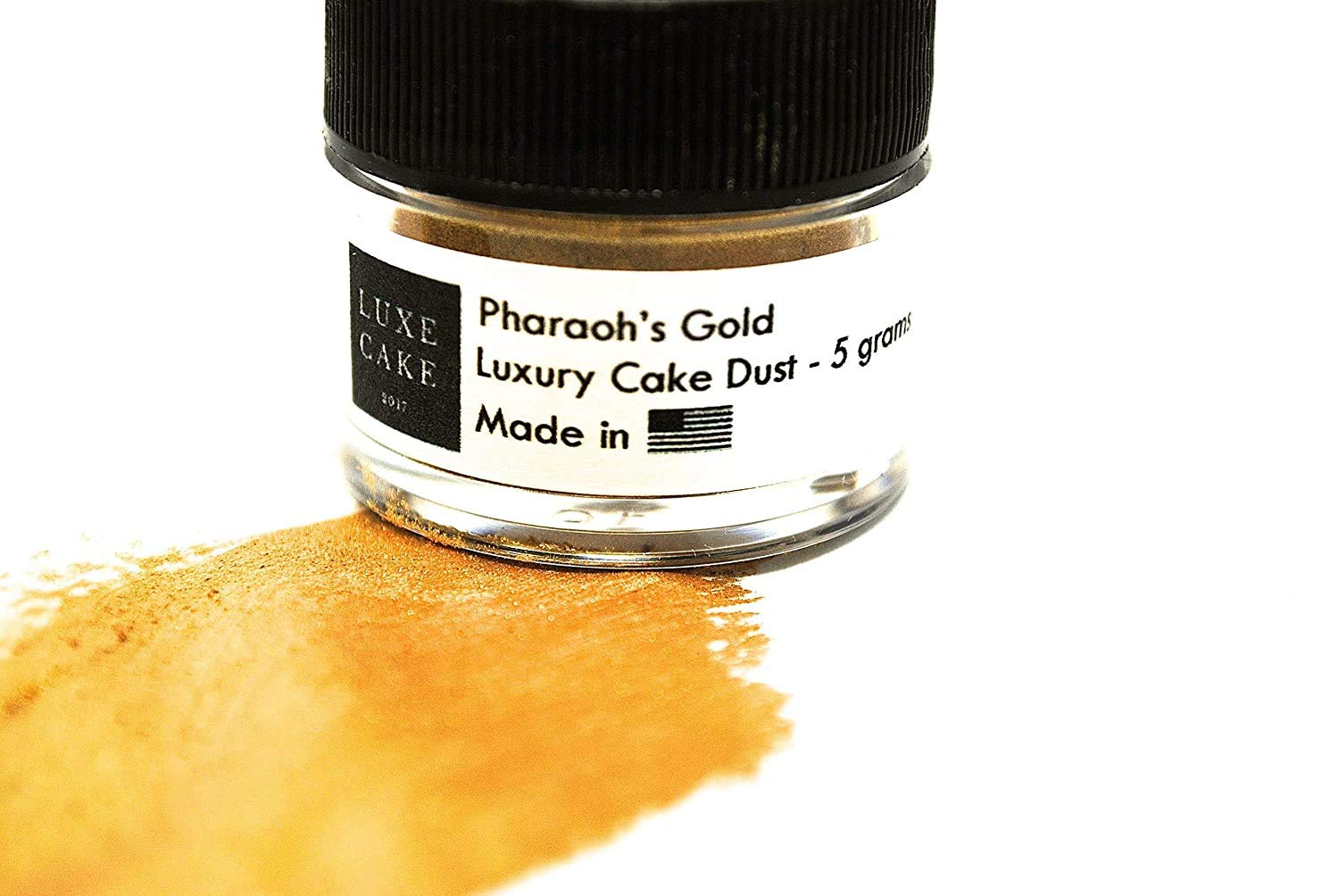 Luxe Cake 24k gold dust being brushed onto a cake for a luxurious edible shimmer.