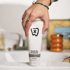 Made by Dentists paste on brush with foamy texture for brushing.