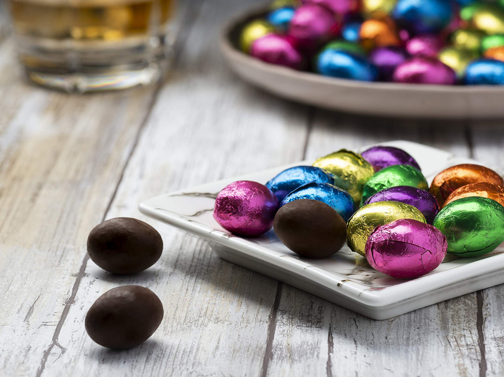 The Madelaine Chocolate Company jewel-tone foil eggs with smooth dark chocolate.