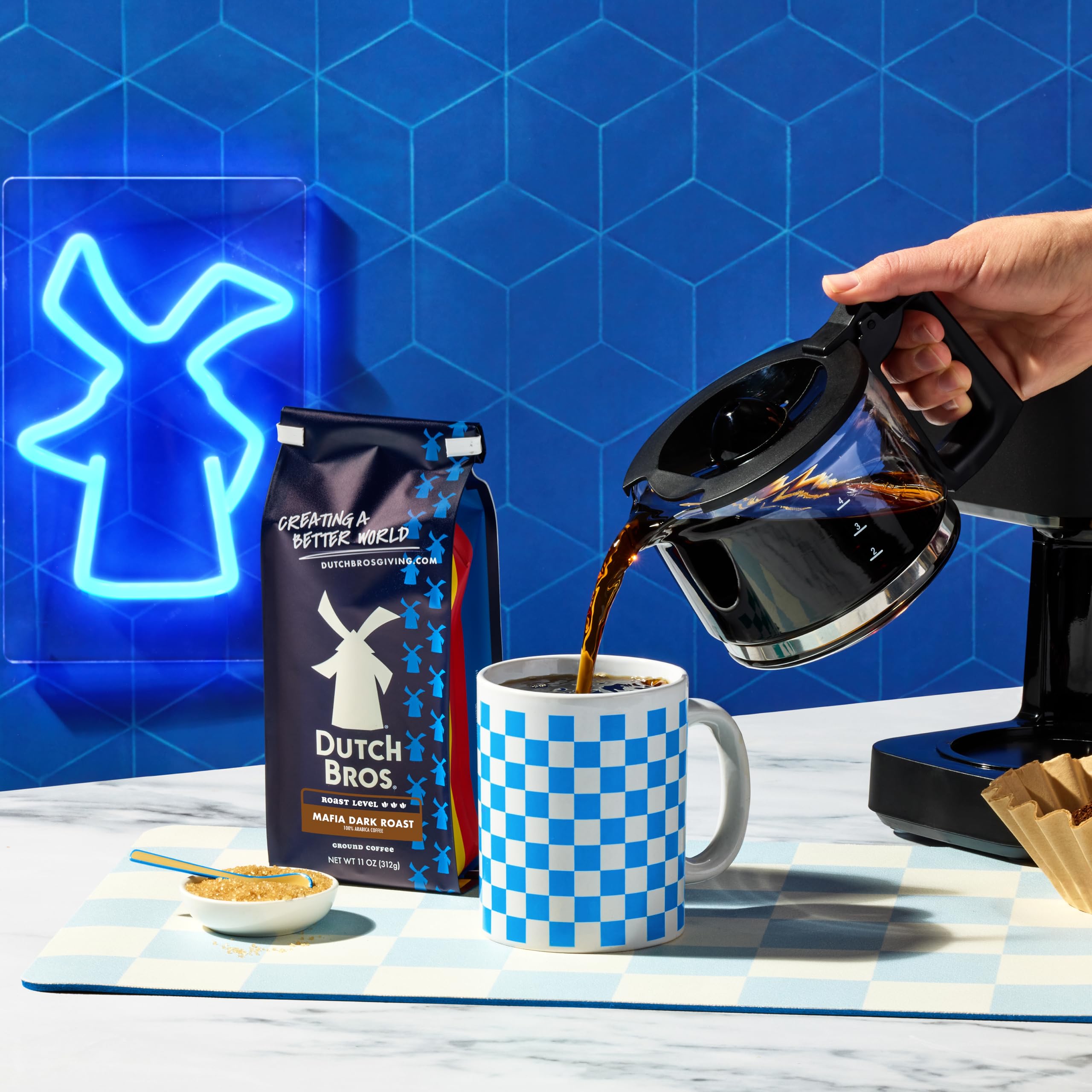 A morning ritual with rising aroma from a frothy mug.