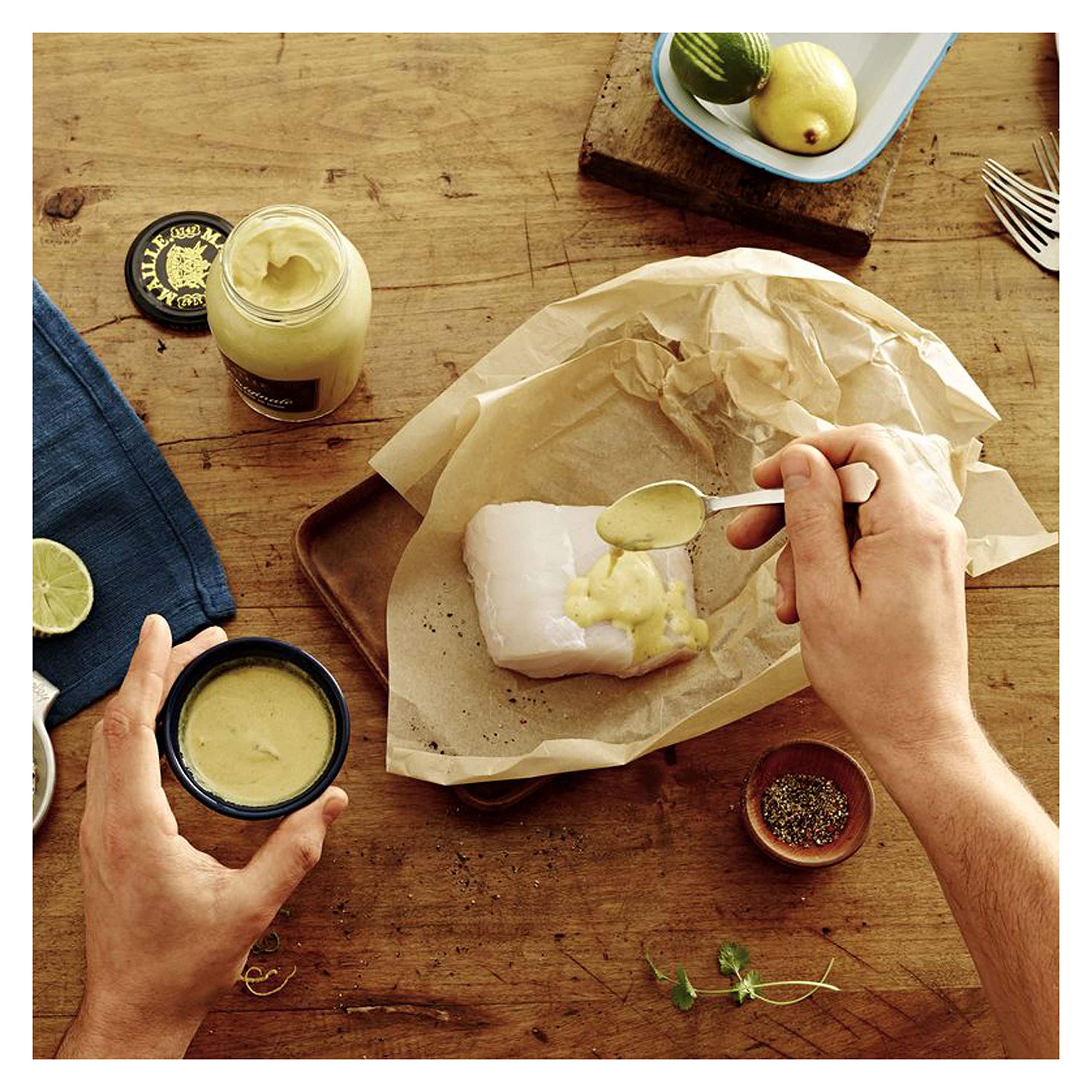 Maille Mustard spread on sandwich demonstrates everyday versatility.
