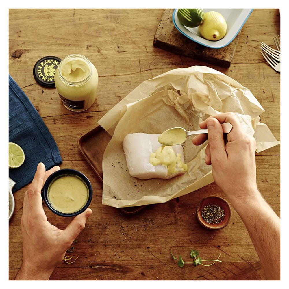 Maille Mustard spread on sandwich demonstrates everyday versatility.