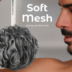 Activated charcoal detail highlighting purifying feel during shower routine.