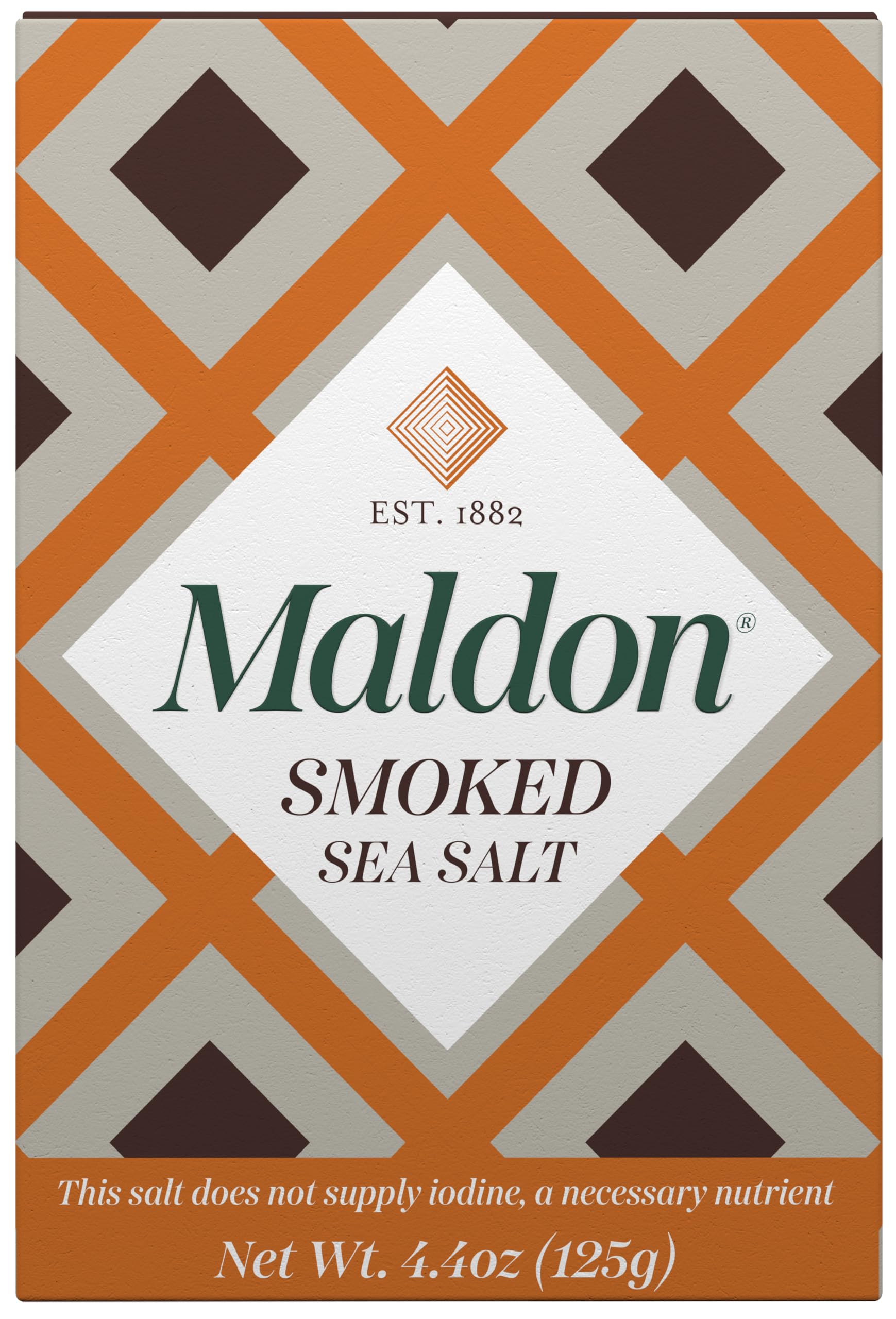 Maldon smoked sea salt flakes bottle closeup enhances flavor with hand-harvested precision.