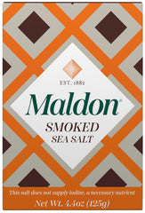 Maldon smoked sea salt flakes bottle closeup enhances flavor with hand-harvested precision.