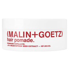 MALIN+GOETZ Hair Pomade bottle pour demonstrates easy application for textured volume.