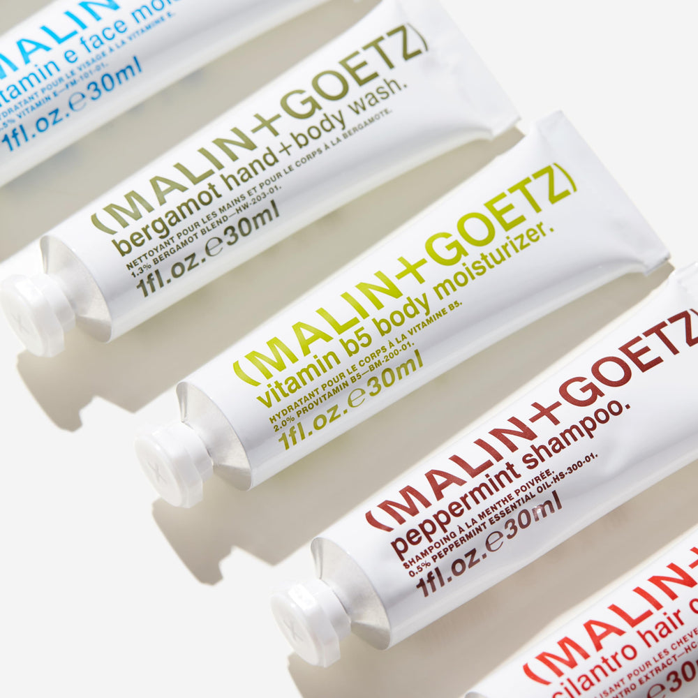 MALIN+GOETZ Peppermint Shampoo lather for refreshing hair.