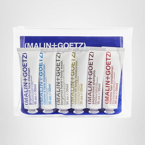 Travel-ready MALIN+GOETZ kit displayed on a vanity.