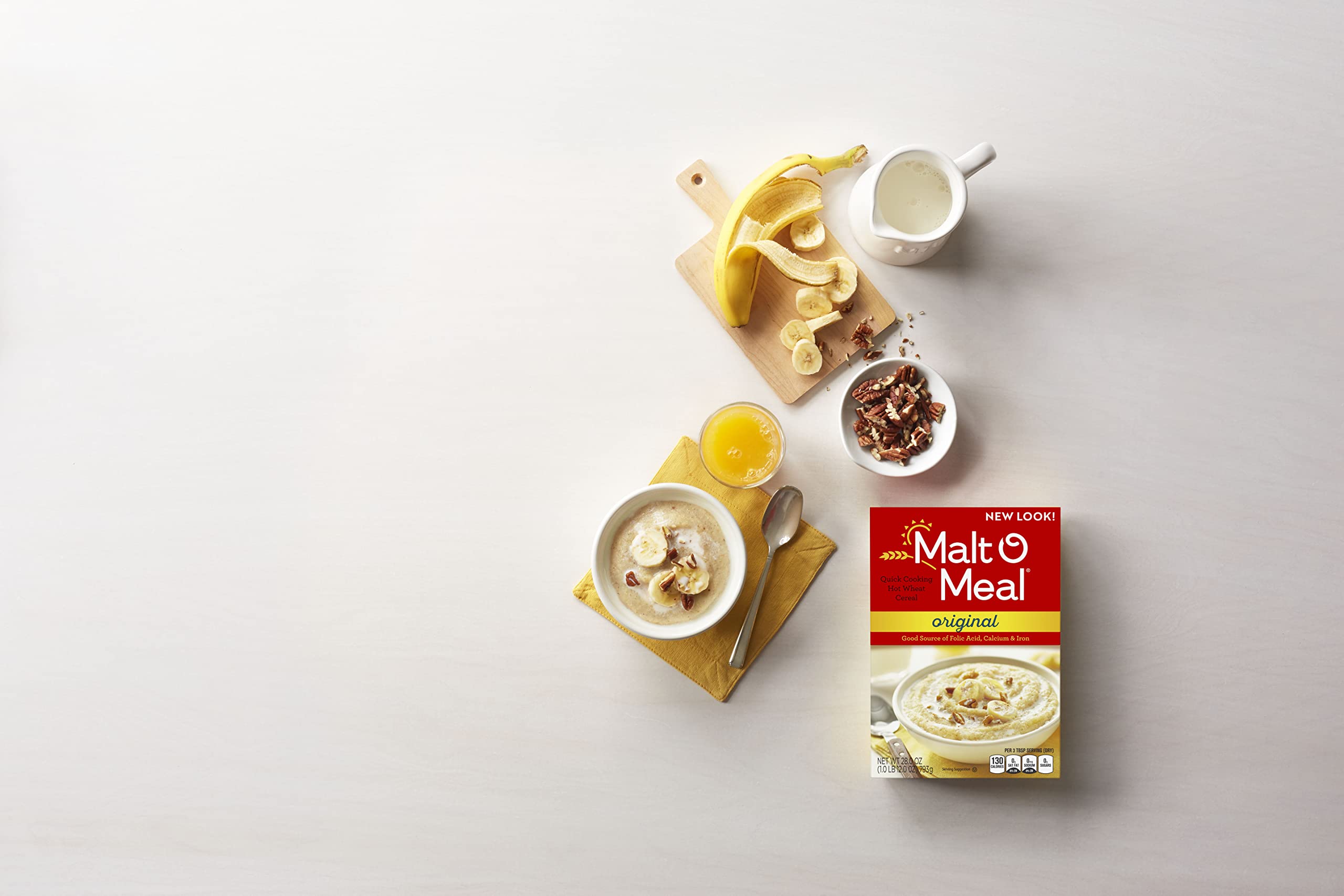 Malt-O-Meal Hot Wheat Cereal milk pour highlights smooth, comforting texture.