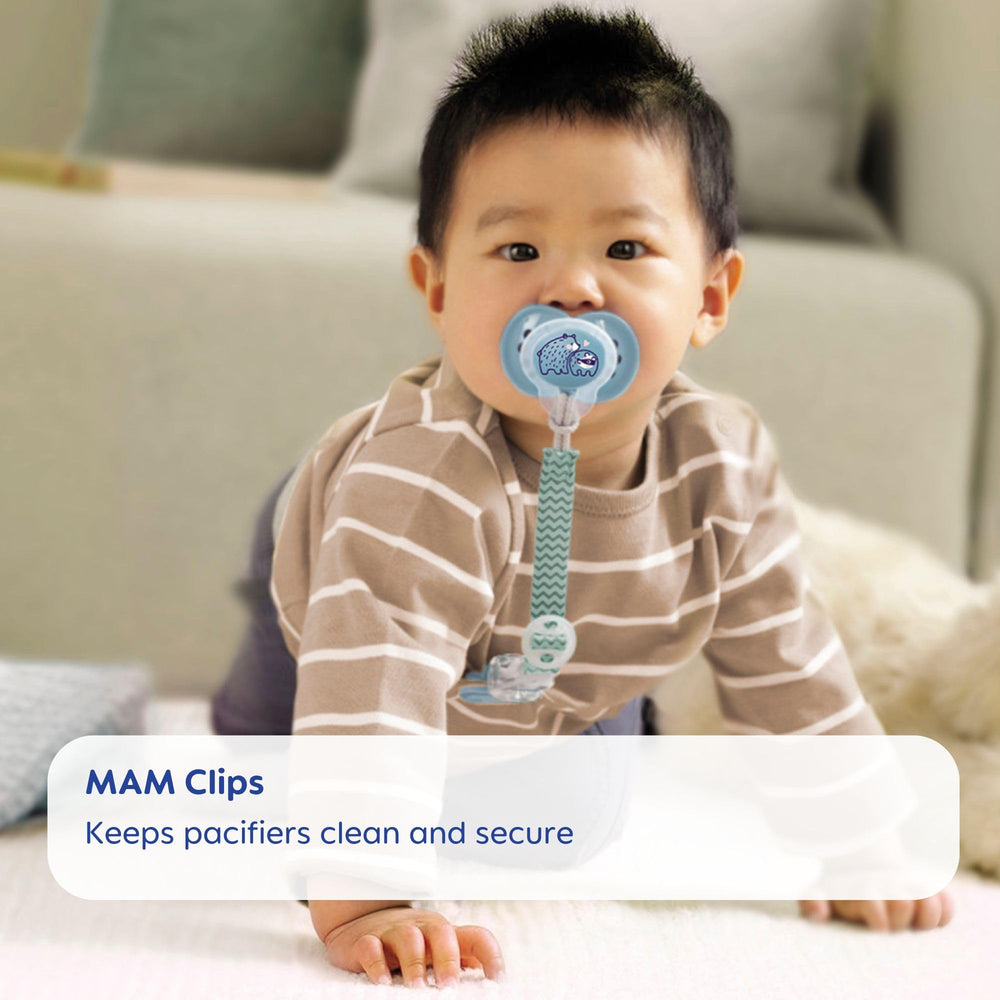 Soft ribbon strap from MAM clip gently rests on baby while securing teether