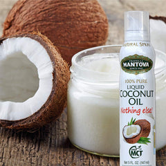 Mantova coconut oil spray on eggs in a hot skillet for frying
