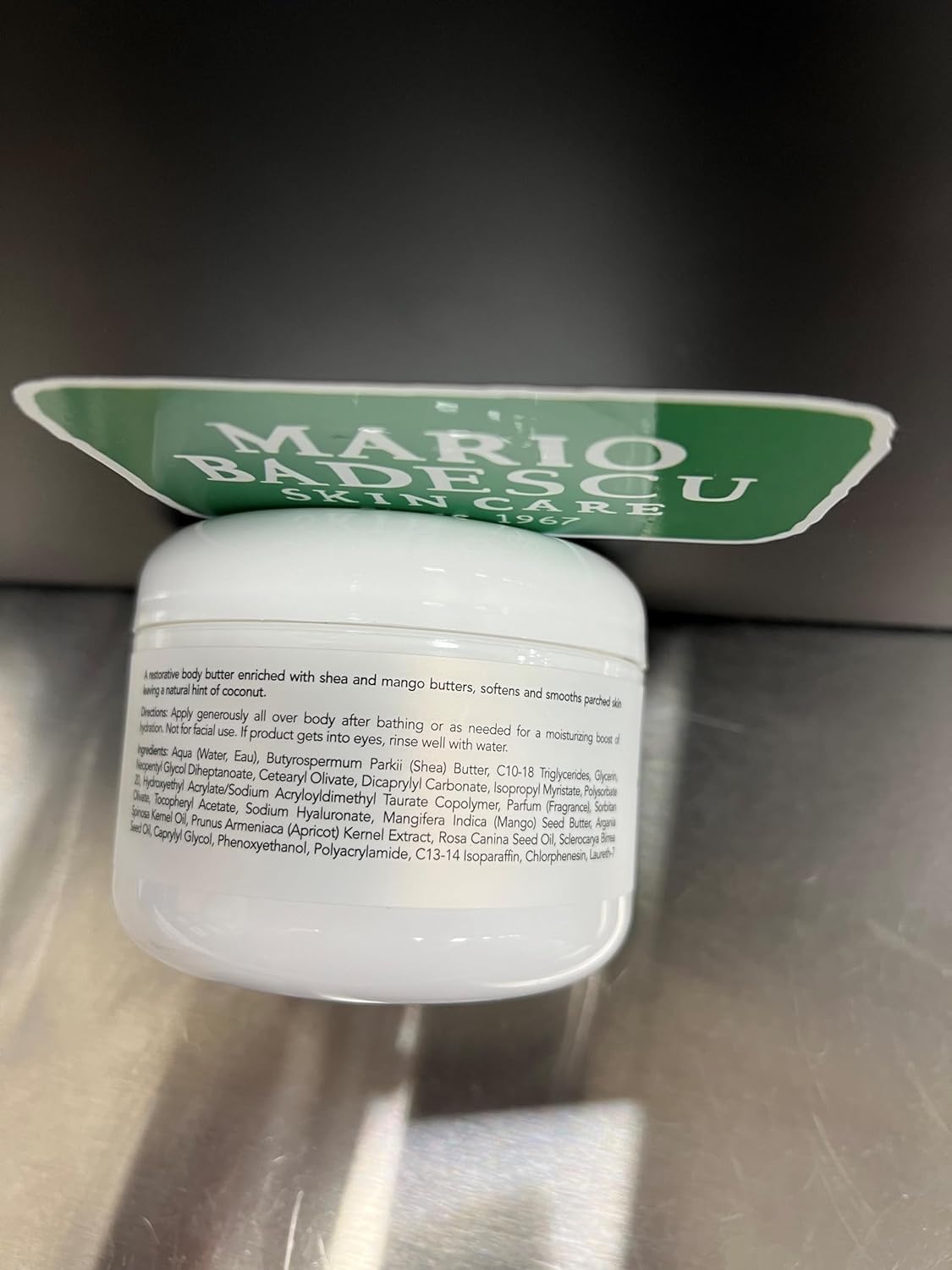 Elbows and knees receiving Mario Badescu Coconut Body Butter treatment